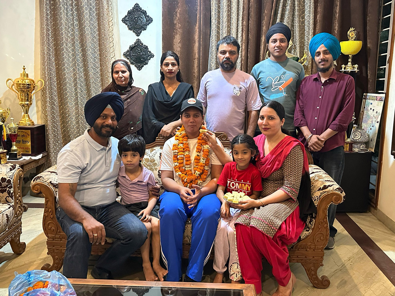 Kurali's daughter Navpreet Kaur won bronze medal in weightlifting during National Games.